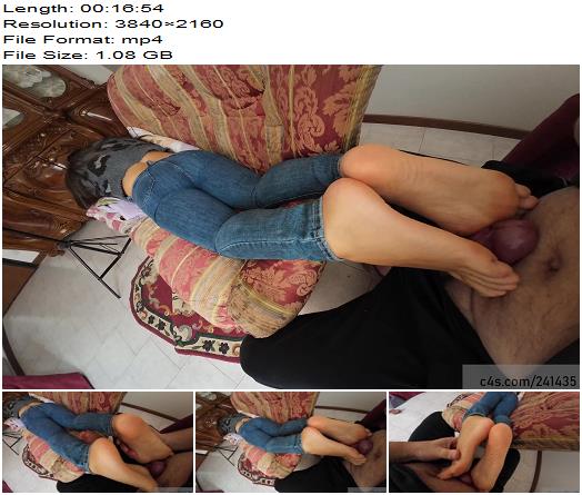 UnderFeetWoman  Barefeet massage with feet on the cock while she is in relax on sofa preview