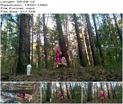Domina Evgenia  a slave tied to a tree sucking my strapon and eating my ashes preview
